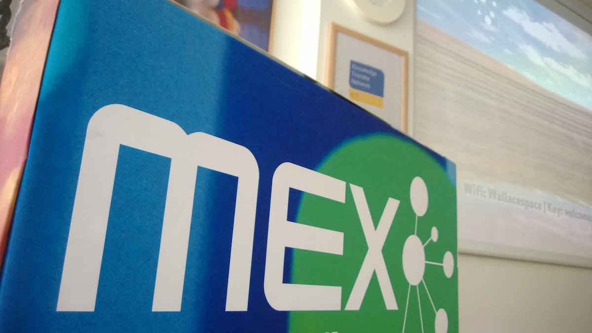 MEX conference room set for speaker presentations